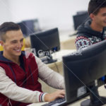 students group in computer lab classroom