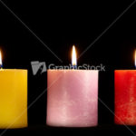 Three candles on black.