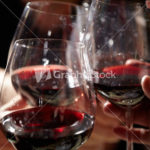 Three red wine glasses.