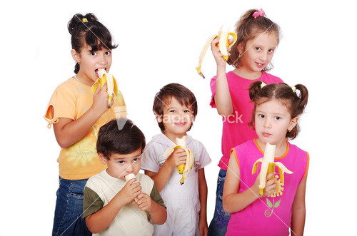 Group of children eating banana isolated