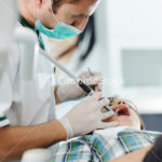 Young dentist at work in the office