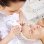 Ultrasonic face cleaning at the beauty spa