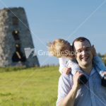 Happy young father and son playing together