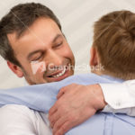 Father giving hugs to dear son