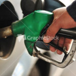 Man refilling the car with fuel on a filling station