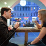 Man and woman chatting over coffee