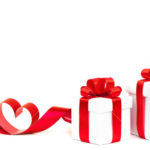 Gift box, bow and heart on a white background