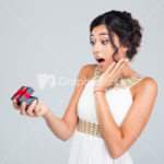 Woman opening jewelry gift box