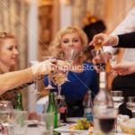 Friends raising their glasses in a toast