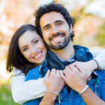 Free couple holding each other