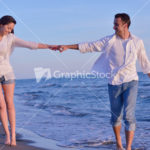 young couple  on beach have fun