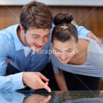 happy young couple in jewelry store