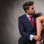 man helping wife with shoe