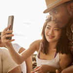 young couple snapping each other